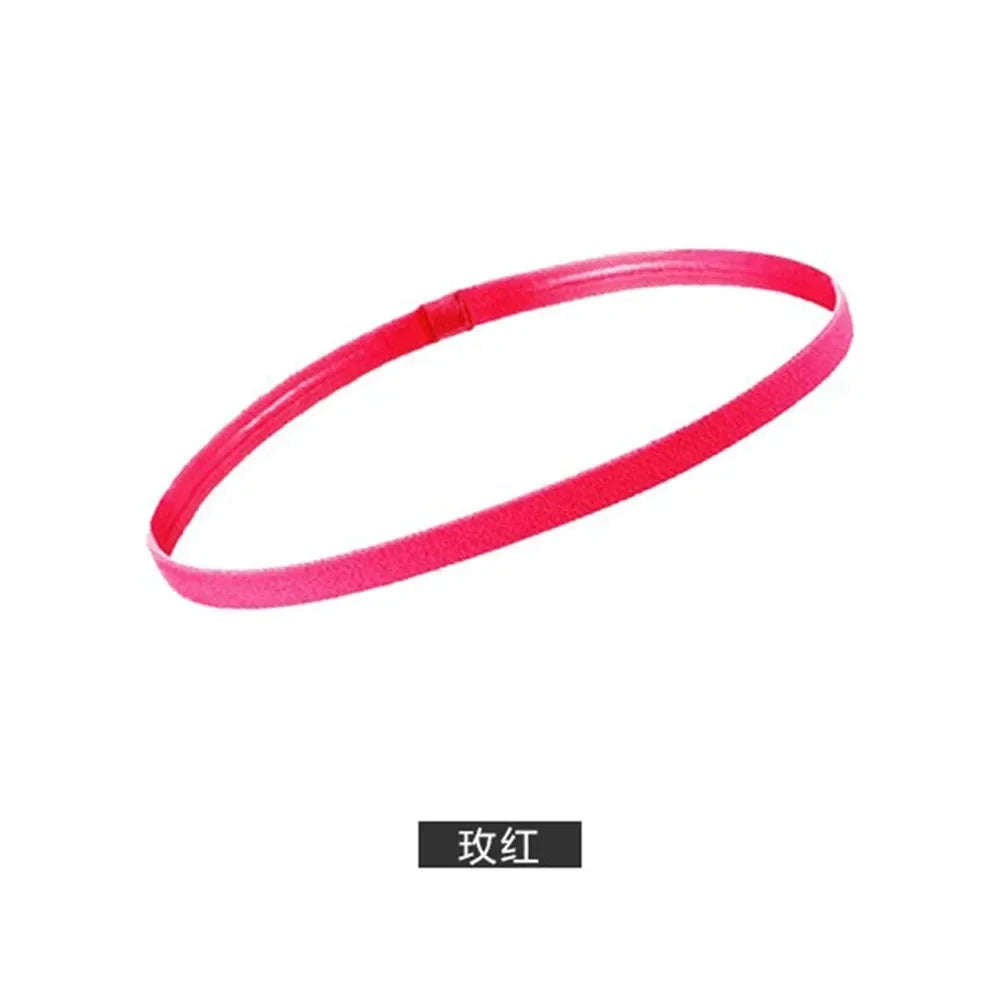 A pink elastic silicone sports headband shown in a loop.