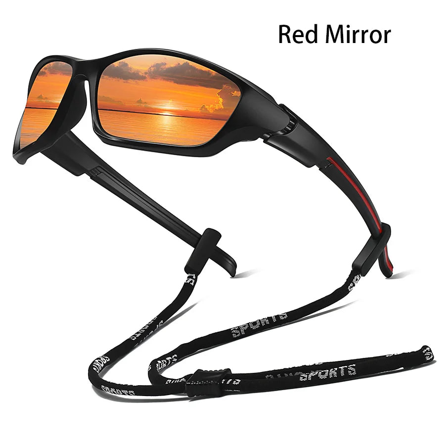 A pair of black sunglasses with a red mirror lens reflecting an orange sunset.