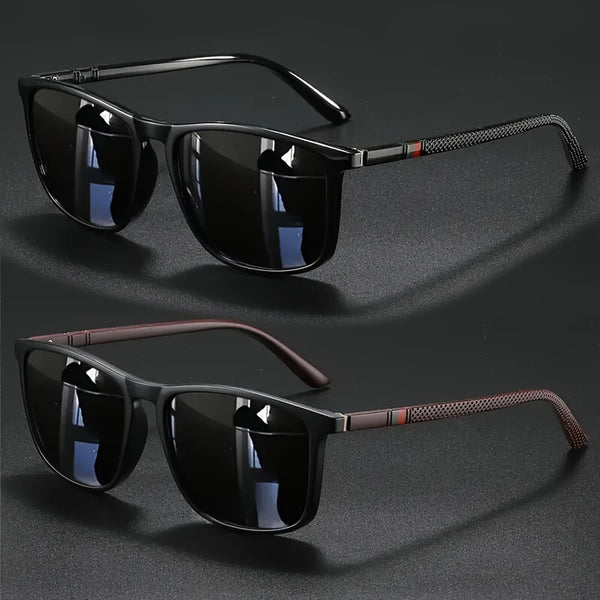 A pair of black vintage square sunglasses with dark lenses and brown accents are displayed on a dark surface.