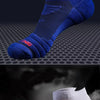 A pair of blue running socks is shown, with a second pair of white athletic socks in the background.