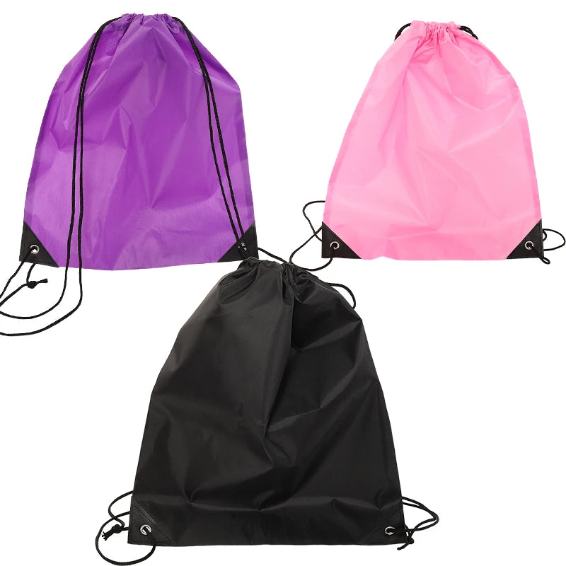 Three drawstring bags in purple, pink, and black nylon fabric displayed against a white background.