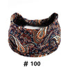 A dark blue and brown boho print cotton headband for hair and workout.