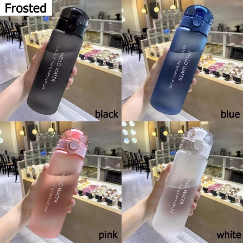 A collection of frosted water bottles in black, blue, pink, and white displayed on a shelf.