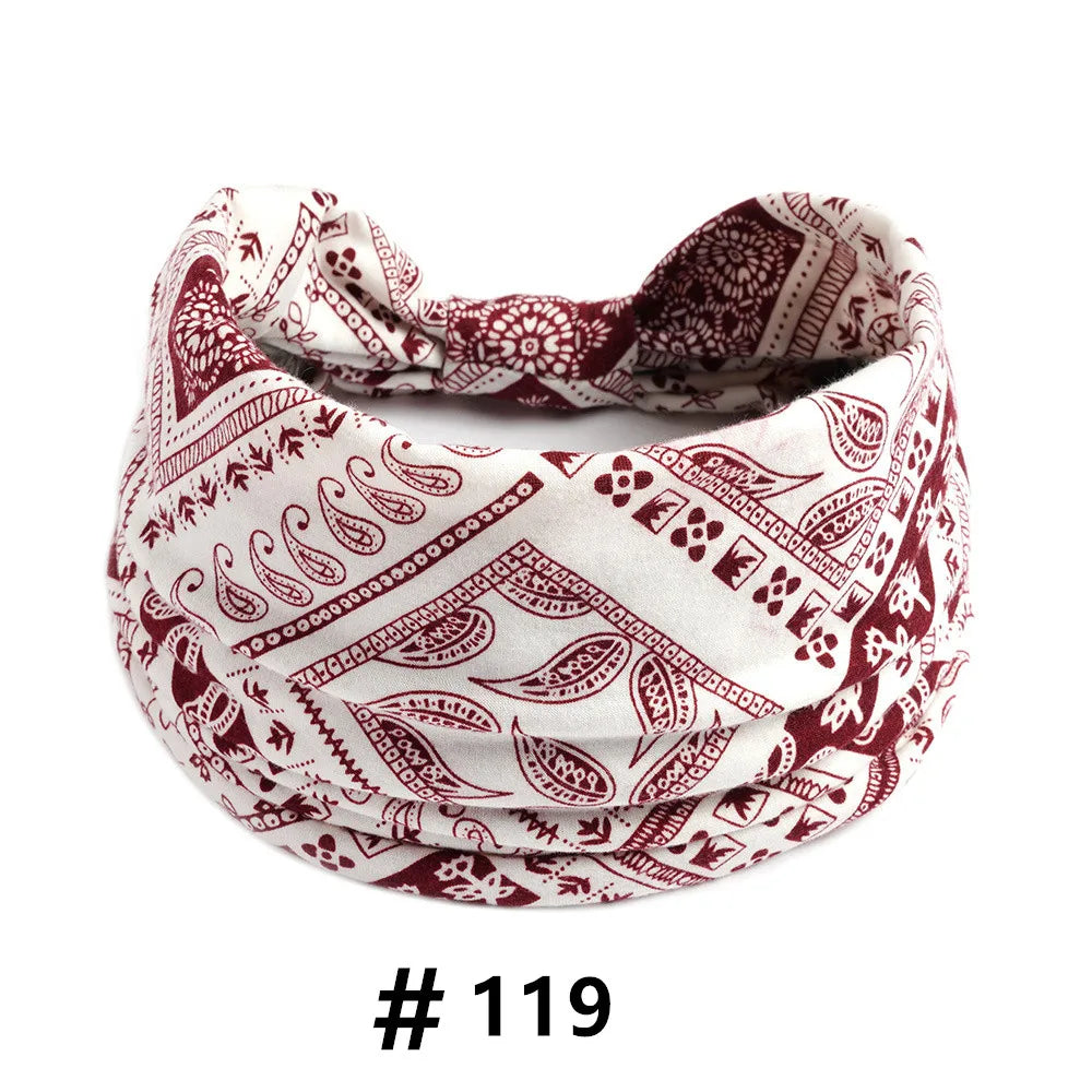 A close-up of a burgundy and white boho print cotton fabric used for hair headbands.