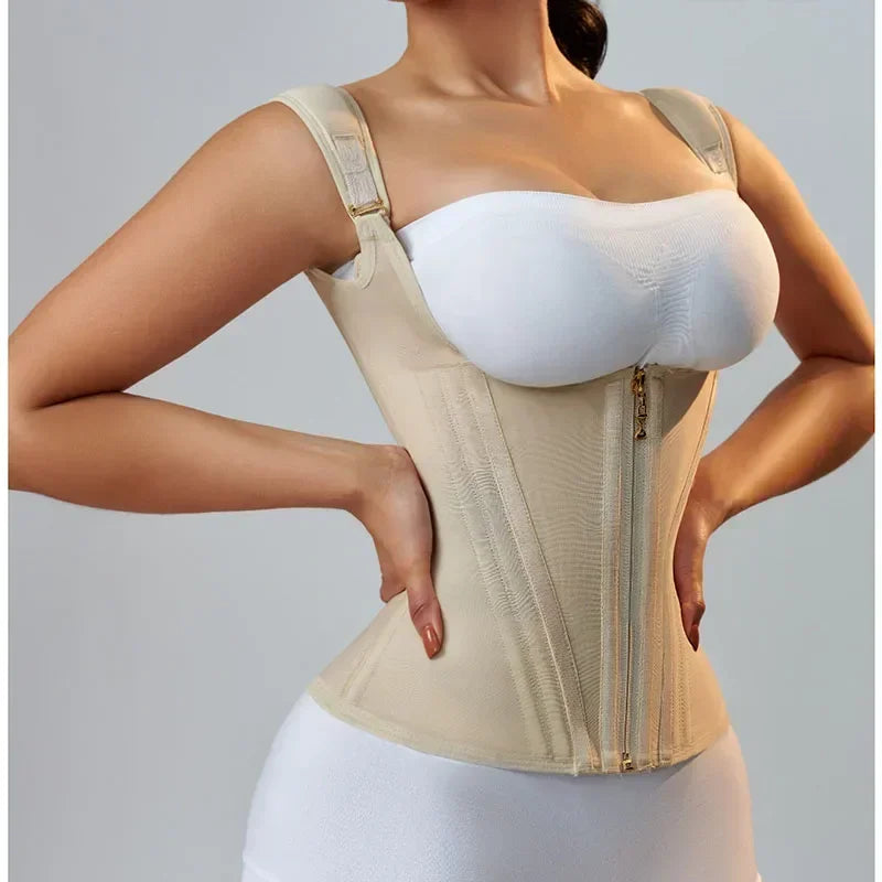 A woman models a beige adjustable body shaper corset vest top with a white bust underneath.