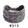 Boho knotted cotton headband featuring intricate geometric patterns in purple, green, and orange.
