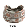 A beige and terracotta patterned boho cotton turban headband with a bow.