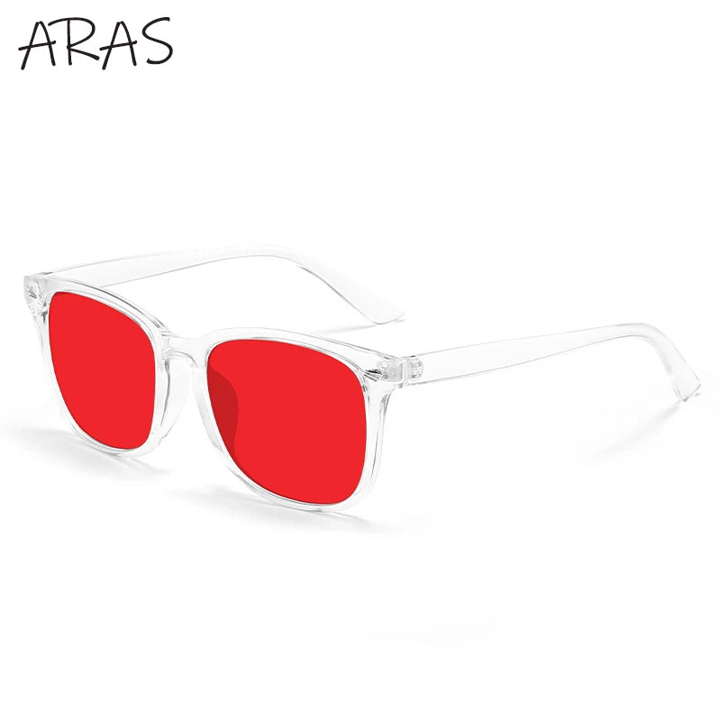 A pair of red tinted anti-blue light glasses with clear frames.