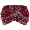 A burgundy fabric headband with white paisley and geometric patterns, suitable for yoga or bohemian style.