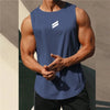A muscular man wearing a navy blue sleeveless sports tank top with a white stripe logo, posing outdoors.