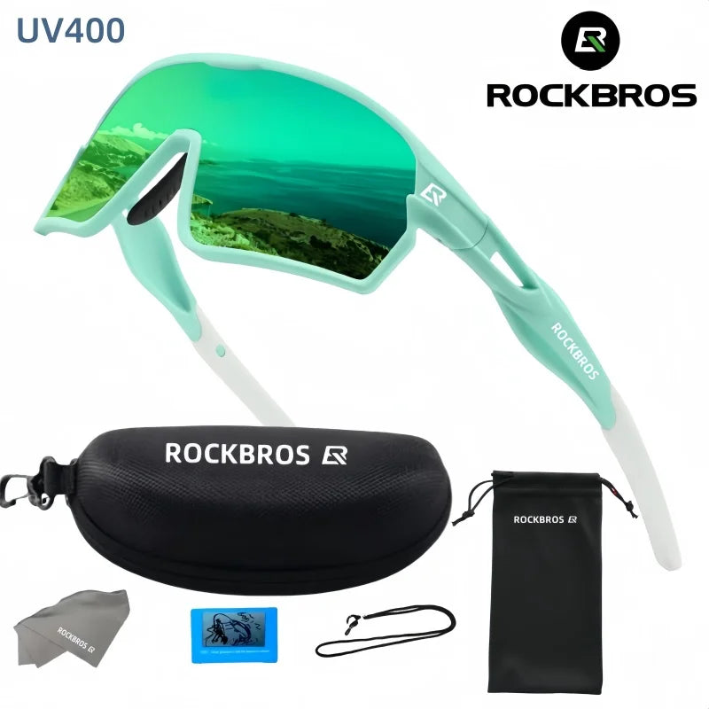 A pair of light green polarized cycling sunglasses with UV400 protection and accessories shown against a white background.