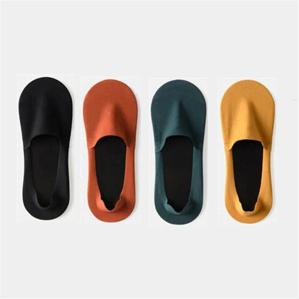 Four pairs of men's invisible boat socks in black, terracotta, dark green, and mustard yellow.