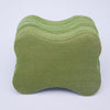 A stack of olive green self-heating lumbar spine patches.