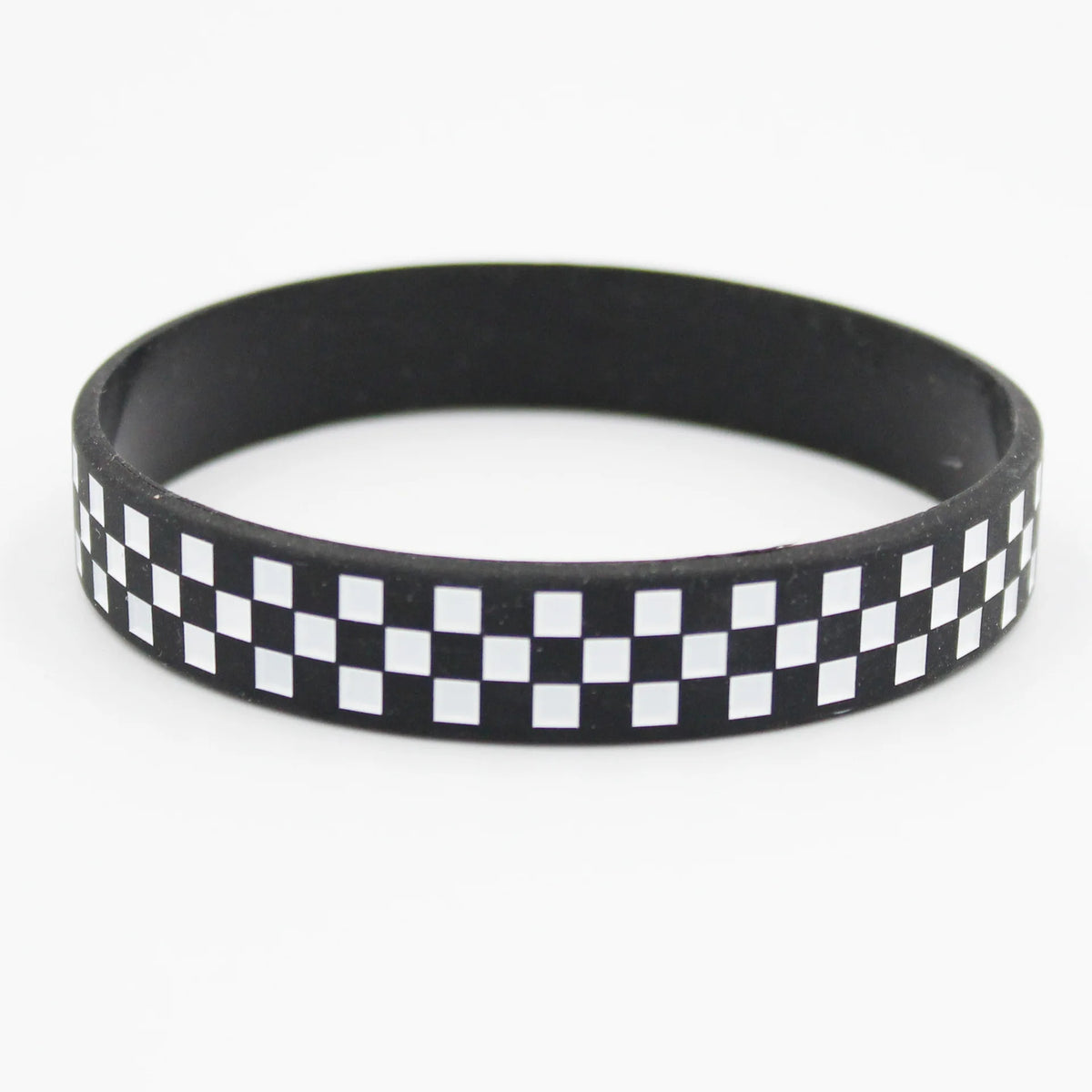 Black silicone wristband with a white checkered pattern.