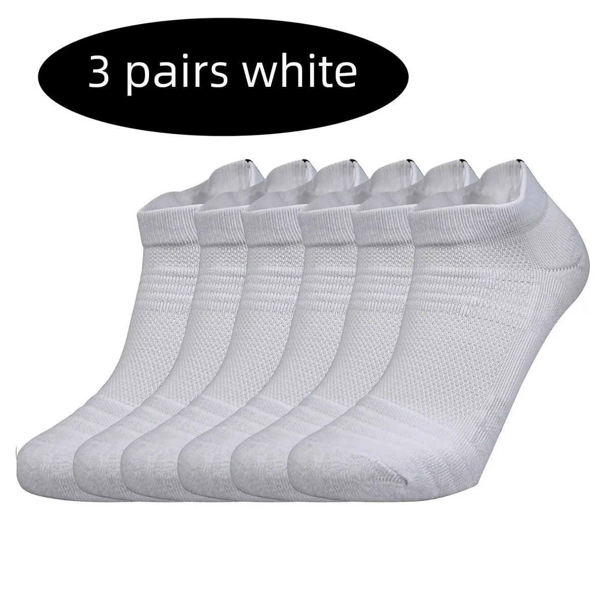 Three pairs of white performance running socks laid out side by side.