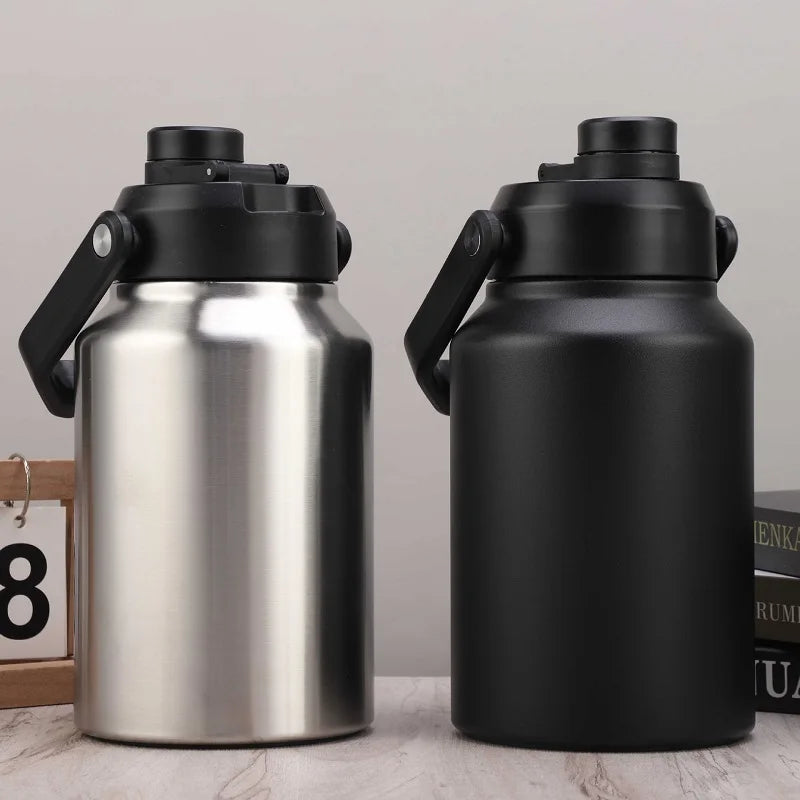 A silver insulated stainless steel thermos flask with a black lid and handle, next to a matte black version.