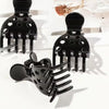 A set of black root lifting hairpin curling clamps with various prong shapes displayed on a white surface.