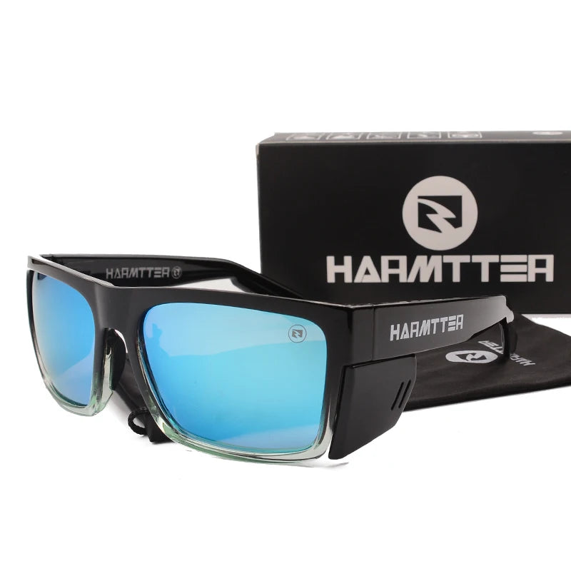 A pair of black Harmtter polarized sports sunglasses with blue lenses displayed on a black box.