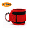 One piece of red and black adjustable neoprene ankle straps for leg training.