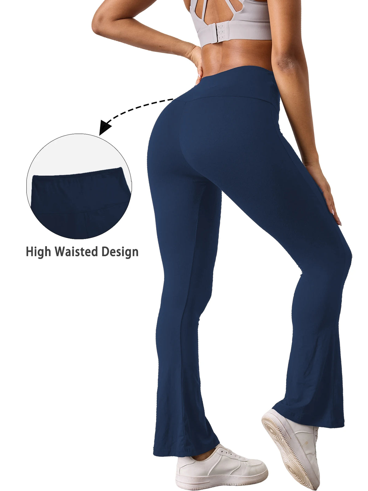 A woman wearing dark blue high-waisted yoga leggings with flare details, demonstrating the high waist design.