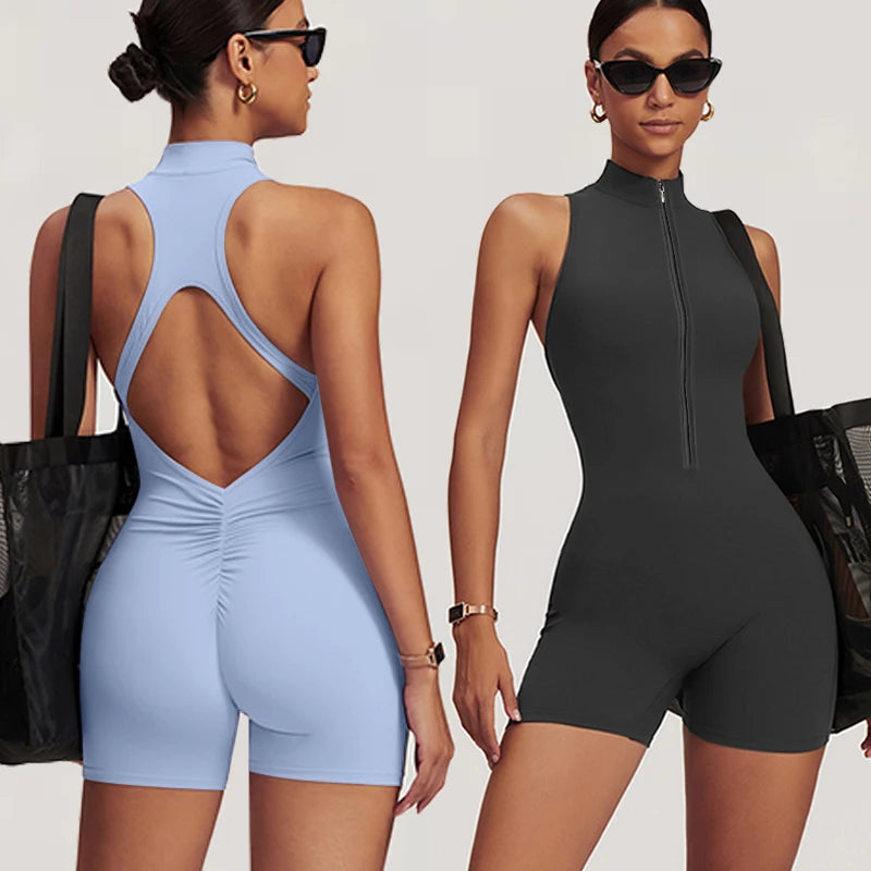 A model wearing a light blue, sleeveless, backless fitness jumpsuit and sunglasses.