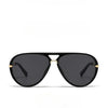 Black fashion protective sunglasses with gold accents viewed from the front