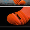 Orange athletic ankle socks shown in various views, highlighting the textured knit and design.