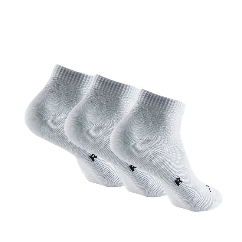 A pair of white performance ankle socks for running and athletic activities shown from the side.