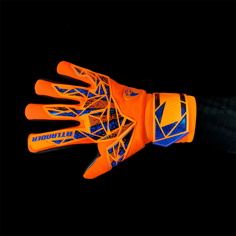 Orange latex goalkeeper gloves with black and blue geometric patterns and an orange wrist strap.