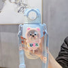 A light blue leak-proof water bottle shaped like a cute bear with the word LUCK on the front.