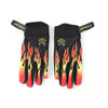 A pair of black motorcycle and MTB gloves featuring orange flame designs on the palms.