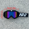 A pair of black heavy-duty motorcycle and ATV goggles with a strap, shown against a gray background.