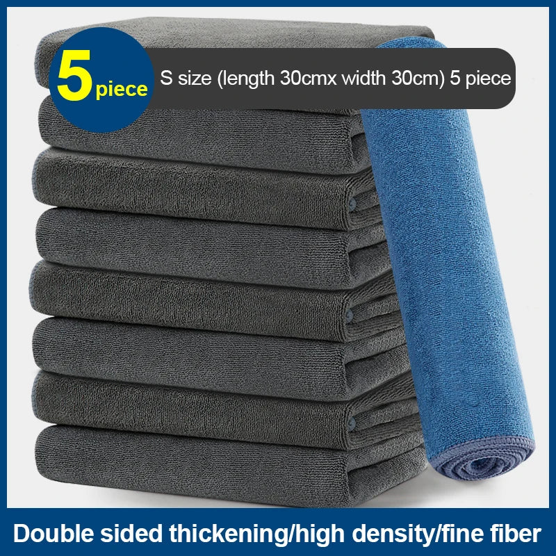 A stack of five gray microfiber car cleaning towels with blue accents.