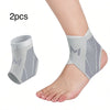 Two gray compression ankle support foot sleeves shown on a person's ankle and an isolated piece.