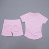 Ensemble de yoga et fitness rose, sans couture pour femmes, composé d'un débardeur court et d'un short assorti.