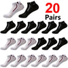 A variety of 20 pairs of men's color-block mesh ankle socks in black, gray, and white colors.