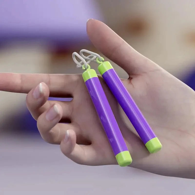 A hand holds a carrot-shaped fidget stress relief toy with white and lime green accents.