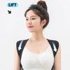 A woman wearing a black posture back brace support for lifting, demonstrating its ergonomic design.