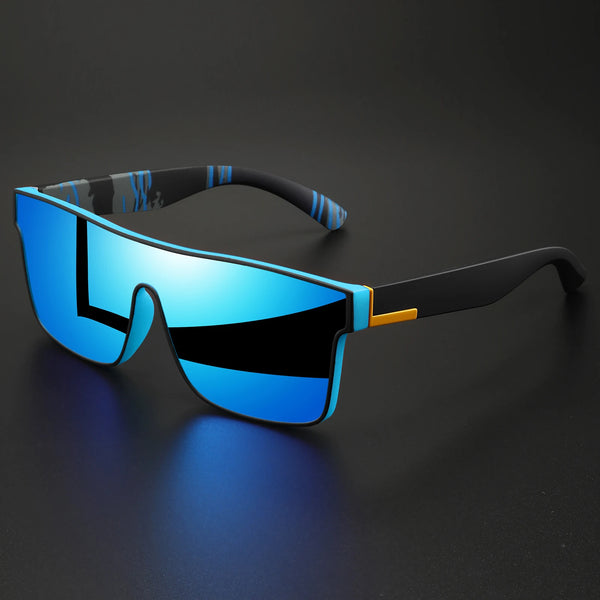 A pair of blue-tinted sunglasses with black frames and a patterned ear strap resting on a dark surface.