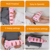 A pink soothing heating pad is shown being used on a person's leg for muscle relief.