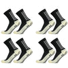 Ein Viererpack strapazierfähige, rutschfeste Sportsocken in schwarz-weiß, von der Seite gezeigt.