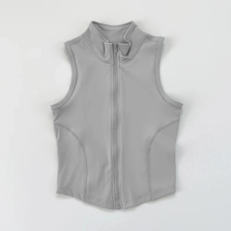 Helles graues Damen-Sport-Crop-Top-Vest mit hohem Kragen und durchgehendem Reißverschluss.