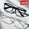 A pair of black square frame blue light blocking glasses and a pair of clear acetate frame blue light blocking glasses.