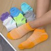A collection of colorful breathable mesh ankle socks in various shades including blue, green, purple, and orange, displayed o