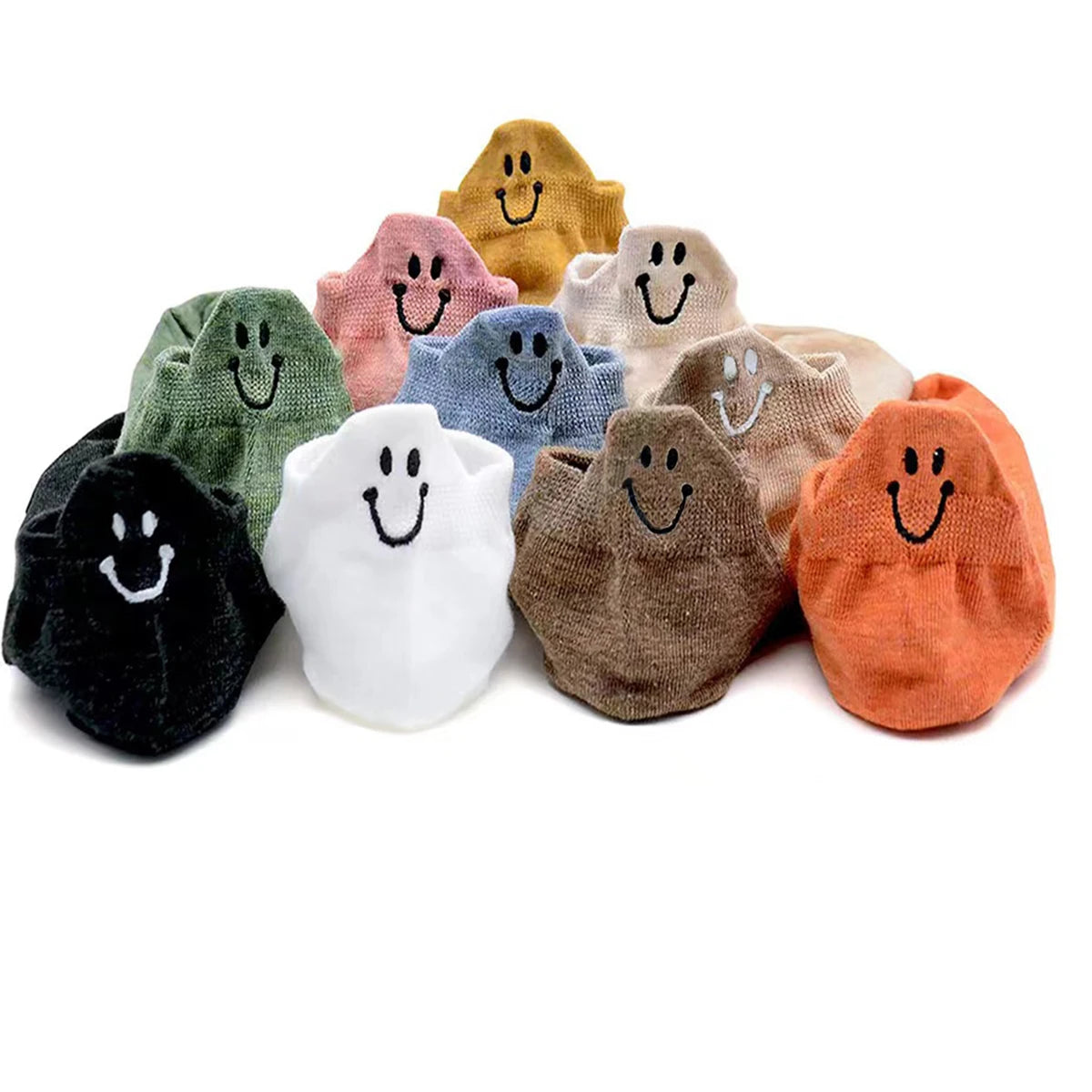 A collection of ten embroidered ankle socks in various pastel and earthy tones, each featuring a smiling face.