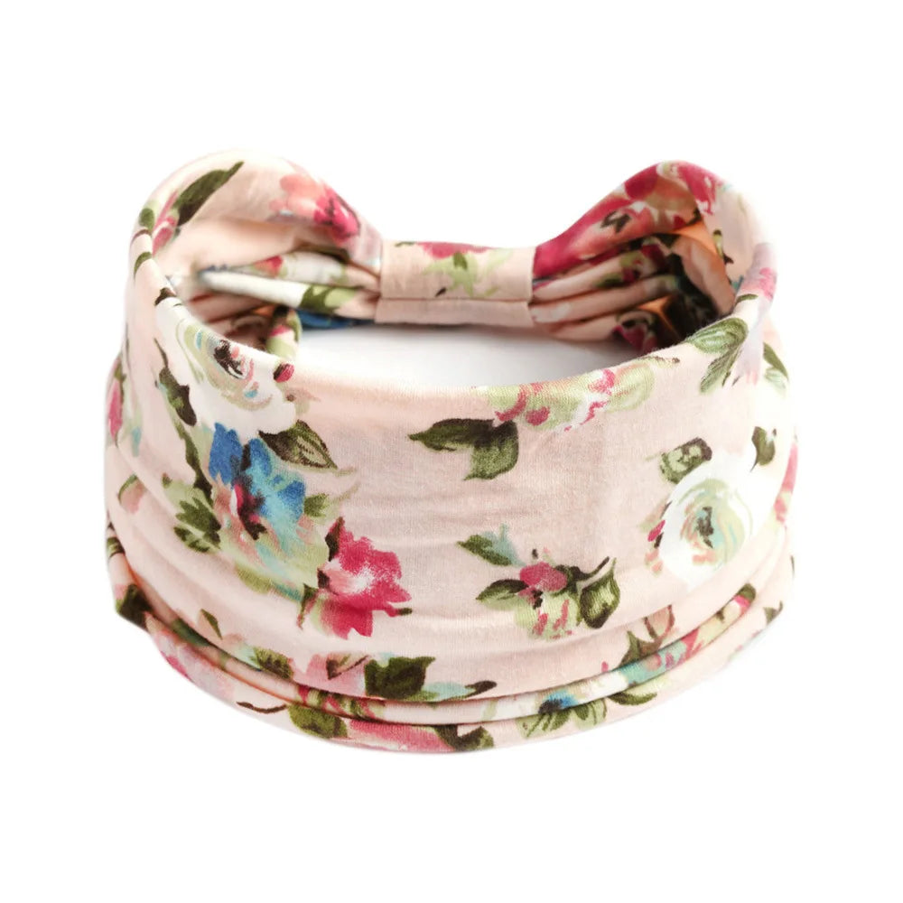 Pink floral cotton stretch headband tied in a bow