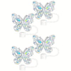 Un set de quatre toppers en silicone pour pailles de papillons clairs pour les boissons.