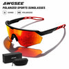 A pair of orange polarized sports sunglasses resting on a black box and pouch.