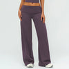A model wearing mauve flared high-waist yoga pants and a matching crop top.