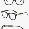 Black and gold framed eyeglasses shown in various angles